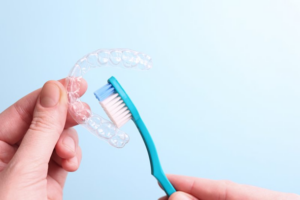 Close up of patient brushing their oral sleep device